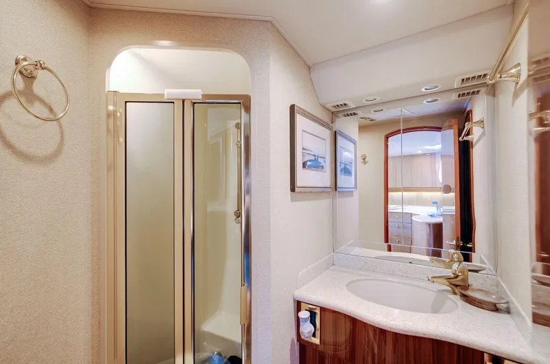 Expresso Yacht Photos Pics Luxurious bathroom interior of 2007 Viking Express yacht with shower and vanity.