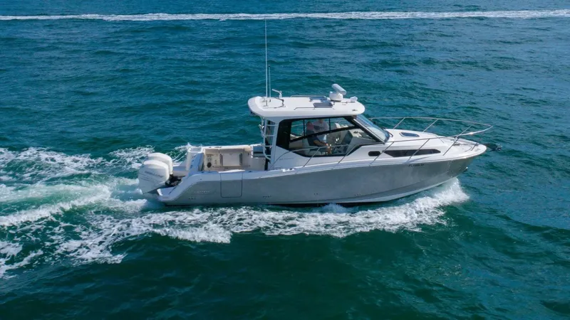  Yacht Photos Pics 2020 Boston Whaler 325 Conquest cruising on open water.