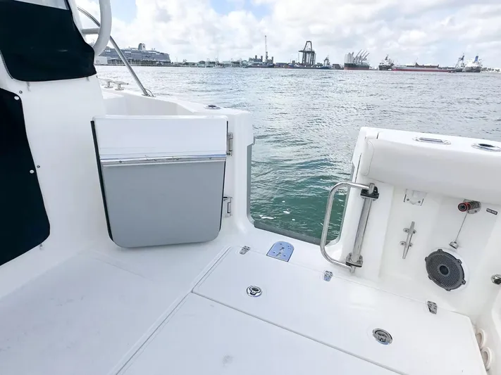 Yacht Photos Pics 2020 Boston Whaler 325 Conquest boat deck with ocean view and distant ships.
