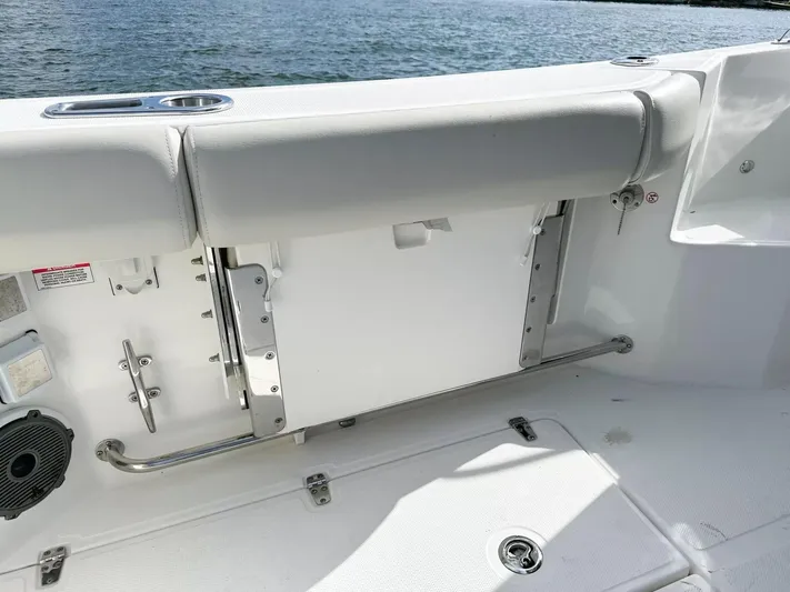  Yacht Photos Pics 2020 Boston Whaler 325 Conquest boat interior with seating and ocean view.