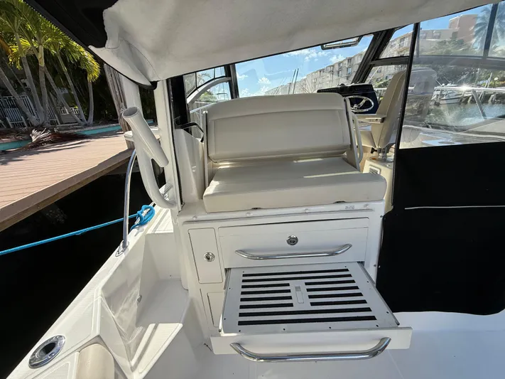  Yacht Photos Pics Interior view of 2020 Boston Whaler 325 Conquest boat with seating and storage.