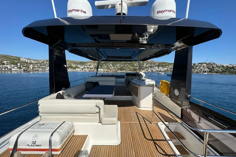 Nm03011 Yacht Photos Pics Luxurious 2022 Beneteau Grand Trawler 62 yacht with spacious deck and scenic ocean view.