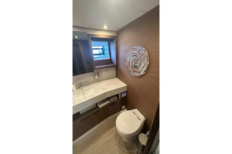 Nm03011 Yacht Photos Pics Luxurious bathroom in 2022 Beneteau Grand Trawler 62 yacht with modern decor.