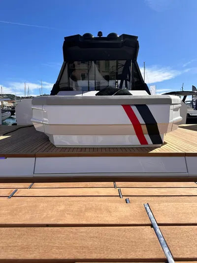  Yacht Photos Pics 2025 Evo Yachts R6+ luxury yacht docked under clear blue sky.