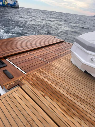  Yacht Photos Pics 2025 Evo Yachts R6+ with wooden deck on open sea.