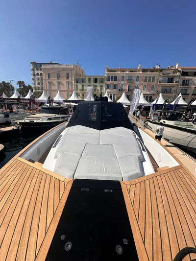  Yacht Photos Pics 2025 Evo Yachts R6+ luxury yacht docked at a marina, showcasing sleek design and modern features.