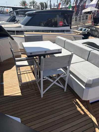  Yacht Photos Pics Luxury Evo Yachts R6+ 2025 deck with seating and table, showcasing modern design.