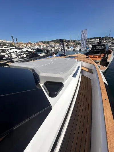  Yacht Photos Pics 2025 Evo Yachts R6+ luxury yacht docked, showcasing sleek design and spacious deck.