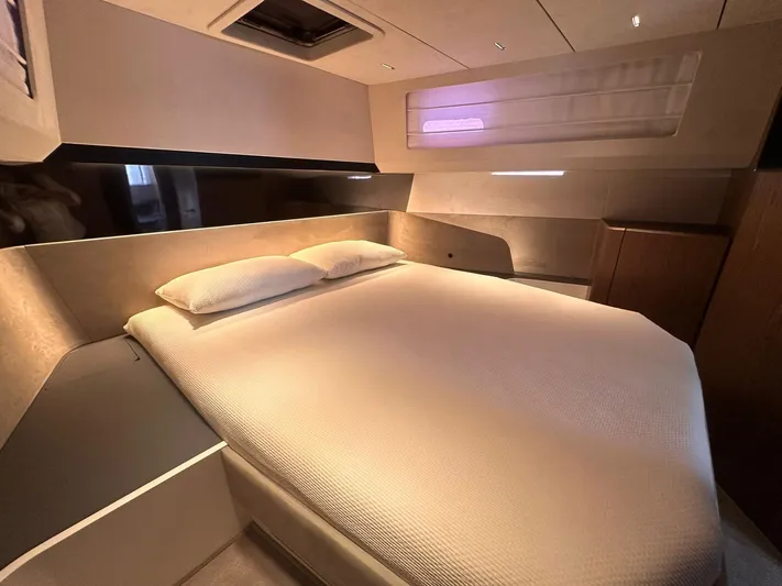  Yacht Photos Pics Luxurious bedroom interior of 2025 Evo Yachts R6+, featuring a cozy double bed.