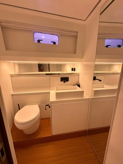  Yacht Photos Pics Modern bathroom in 2025 Evo Yachts R6+, featuring sleek design and ambient lighting.