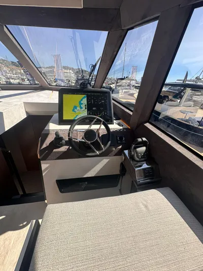  Yacht Photos Pics 2025 Evo Yachts R6+ cockpit with modern navigation system and steering wheel.