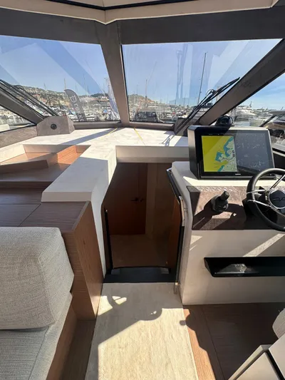  Yacht Photos Pics Interior view of 2025 Evo Yachts R6+ with modern navigation system and panoramic windows.