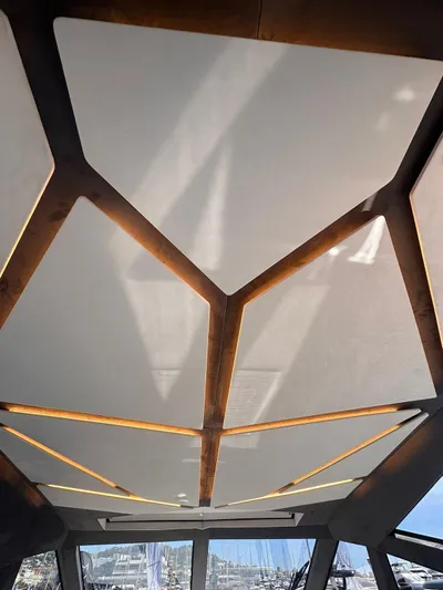  Yacht Photos Pics Ceiling design of 2025 Evo Yachts R6+ with geometric panels and natural lighting.