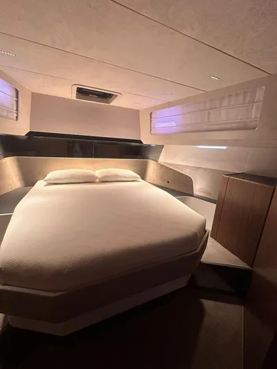  Yacht Photos Pics Luxurious interior of 2025 Evo Yachts R6+, featuring a cozy bedroom with modern design.