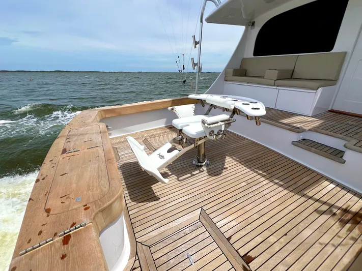 Pre Sail Yacht Photos Pics 2000 Blackwell Carolina Custom boat with wooden deck and fishing chair on open water.