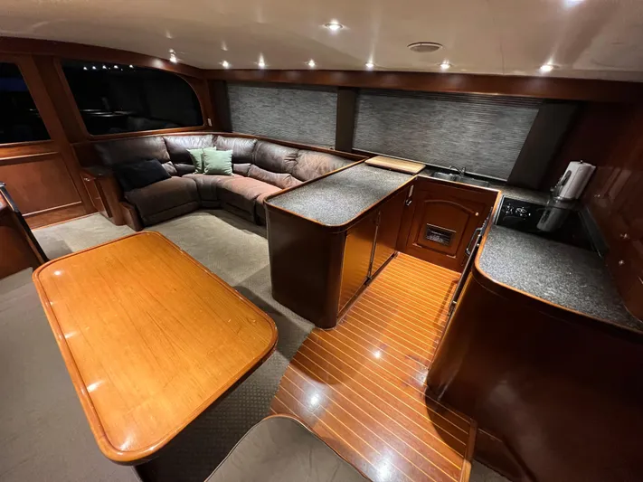 Pre Sail Yacht Photos Pics Luxurious interior of a 2000 Blackwell Carolina Custom yacht with wood finishes and plush seating.