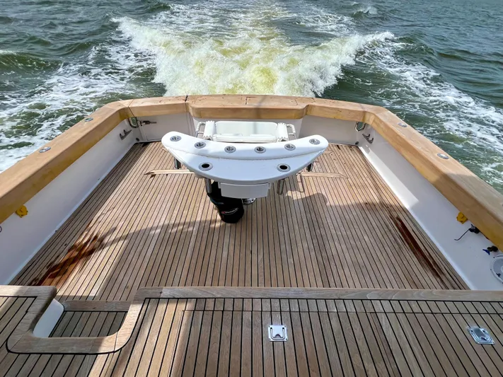 Pre Sail Yacht Photos Pics Back deck of a 2000 Blackwell Carolina Custom boat cruising on water.