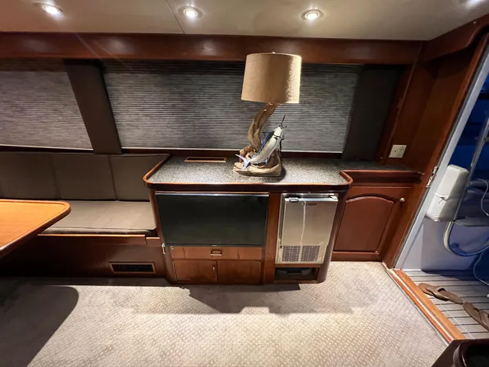 Pre Sail Yacht Photos Pics Interior of a 2000 Blackwell Carolina Custom yacht with a lamp and mini-fridge.