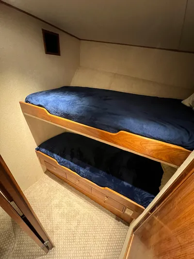 Pre Sail Yacht Photos Pics Bunk beds in 2000 Blackwell Carolina Custom boat cabin with blue bedding.
