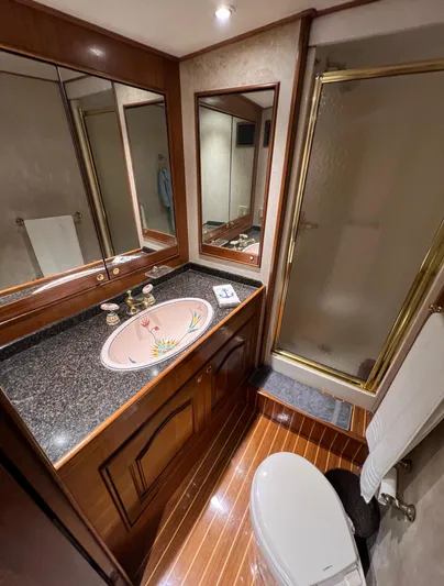Pre Sail Yacht Photos Pics Luxurious bathroom in a 2000 Blackwell Carolina Custom yacht with granite countertop and glass shower.