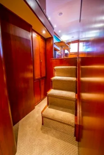 Pre Sail Yacht Photos Pics Interior of 2000 Blackwell Carolina Custom yacht with wooden stairs and cabinetry.