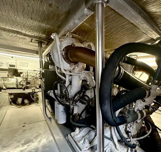 Pre Sail Yacht Photos Pics Engine room of a 2000 Blackwell Carolina Custom boat, showcasing mechanical components and piping.