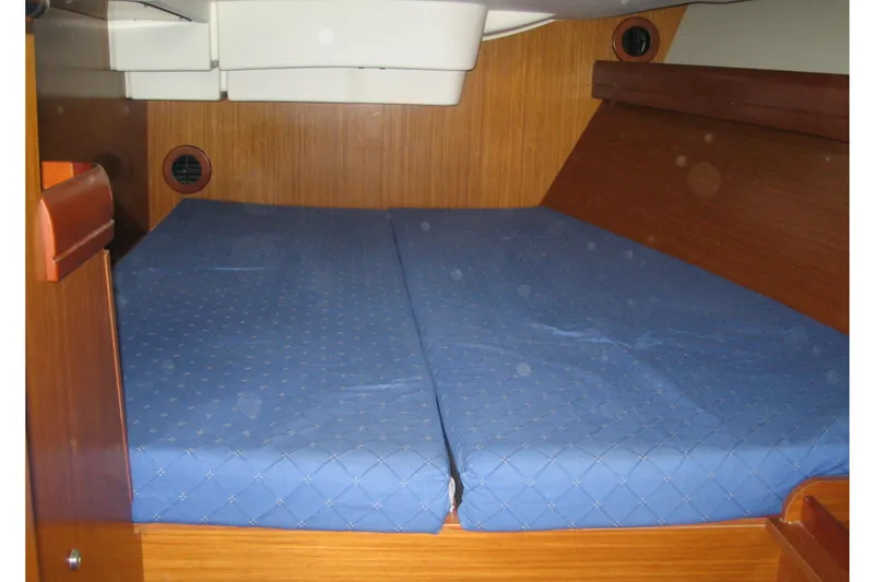  Yacht Photos Pics Interior cabin of 2018 Jeanneau Sun Odyssey 419 with blue mattress.