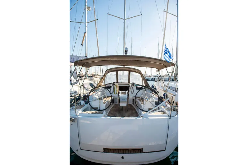 Yacht Photos Pics 2018 Jeanneau Sun Odyssey 419 sailboat with dual steering wheels in a marina.