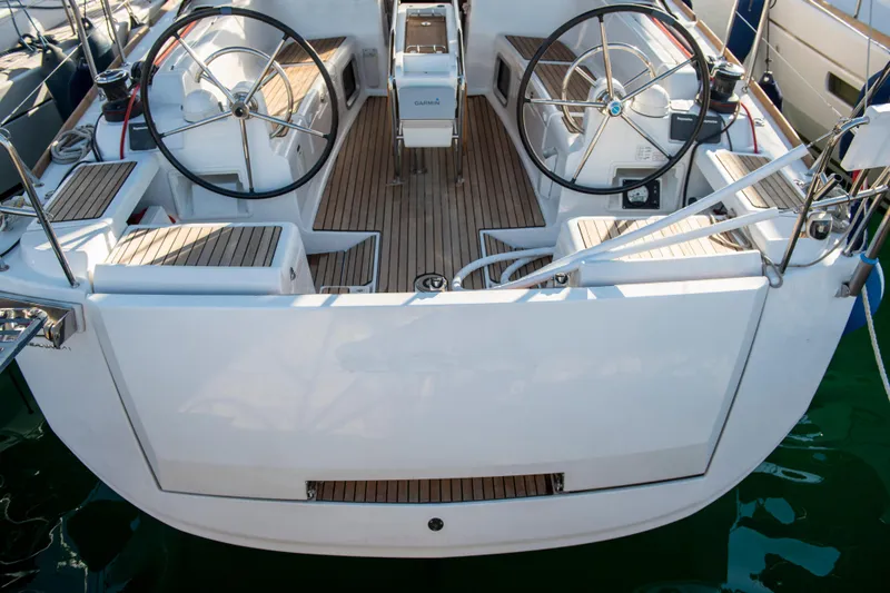  Yacht Photos Pics 2018 Jeanneau Sun Odyssey 419 yacht cockpit with dual steering wheels and teak flooring.