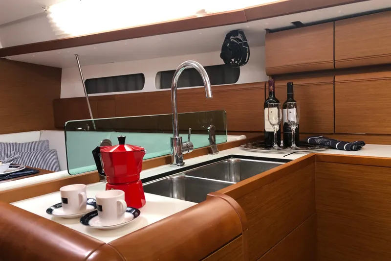  Yacht Photos Pics Luxurious kitchen interior of 2018 Jeanneau Sun Odyssey 419 yacht with modern amenities.