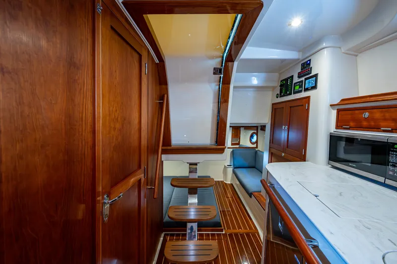 Yes Day Yacht Photos Pics Interior of 2021 Hinckley Sport Boat 40 X with wood finishes and modern amenities.
