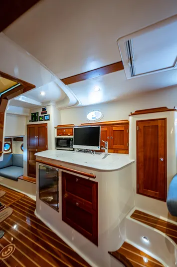 Yes Day Yacht Photos Pics 2021 Hinckley Sport Boat 40 X interior with wood accents and modern amenities.