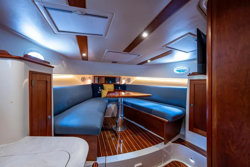 Yes Day Yacht Photos Pics Interior of 2021 Hinckley Sport Boat 40 X with elegant seating and wooden finishes.