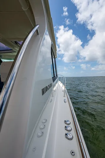 Yes Day Yacht Photos Pics Hinckley Sport Boat 40 X, 2021 model, cruising on open water under a blue sky.