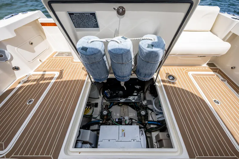 Yes Day Yacht Photos Pics Engine compartment of 2021 Hinckley Sport Boat 40 X, showcasing mechanical components and storage.