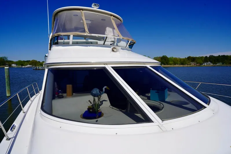 Cheaper II Keep Her Yacht Photos Pics 2002 Sea Ray 480 Sedan Bridge yacht on a sunny day.