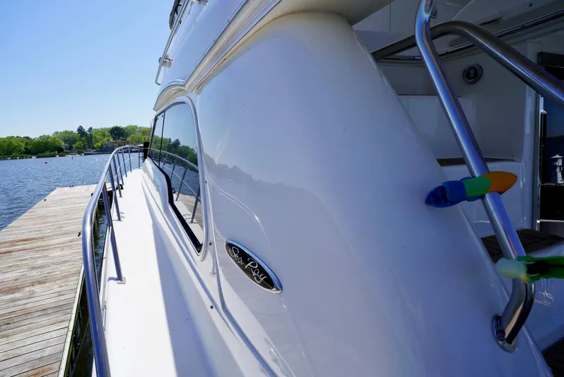 Cheaper II Keep Her Yacht Photos Pics 2002 Sea Ray 480 Sedan Bridge yacht docked at a marina.