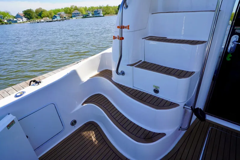 Cheaper II Keep Her Yacht Photos Pics 2002 Sea Ray 480 Sedan Bridge boat steps and deck by the water