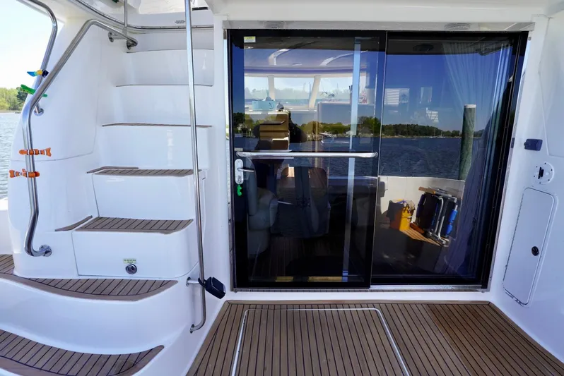 Cheaper II Keep Her Yacht Photos Pics 2002 Sea Ray 480 Sedan Bridge yacht with teak deck and sliding glass door.