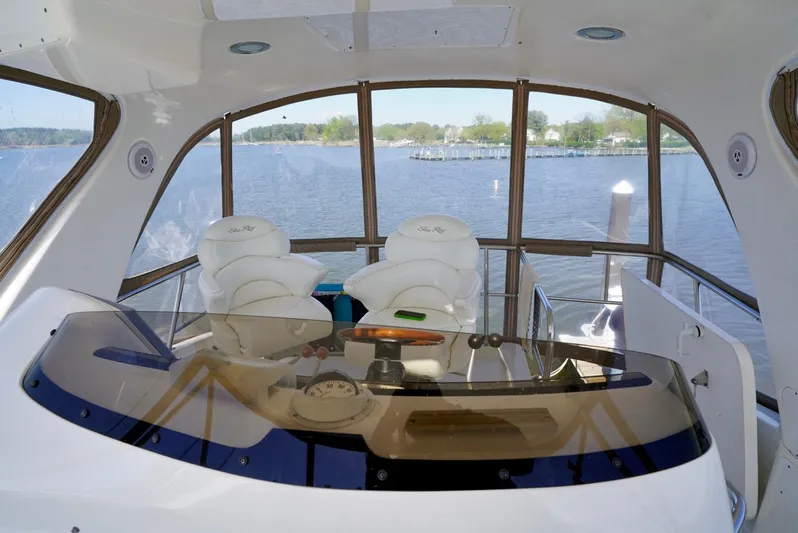 Cheaper II Keep Her Yacht Photos Pics Interior view of 2002 Sea Ray 480 Sedan Bridge yacht helm station.
