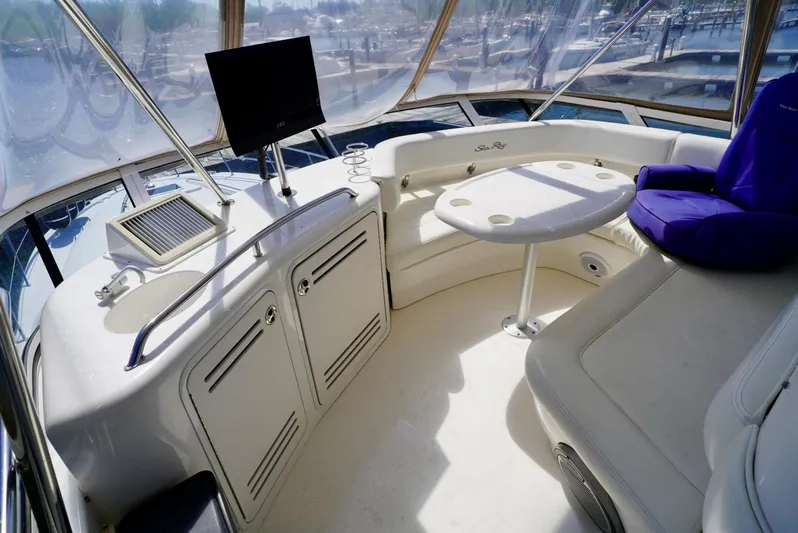 Cheaper II Keep Her Yacht Photos Pics 2002 Sea Ray 480 Sedan Bridge interior with seating, table, and helm station.