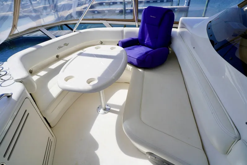 Cheaper II Keep Her Yacht Photos Pics 2002 Sea Ray 480 Sedan Bridge boat interior with white seating and table.