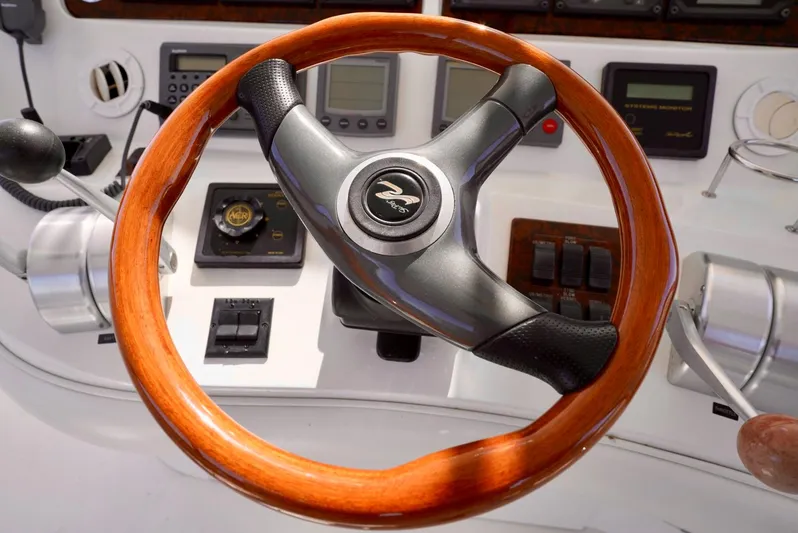 Cheaper II Keep Her Yacht Photos Pics Steering wheel and dashboard of a 2002 Sea Ray 480 Sedan Bridge yacht.