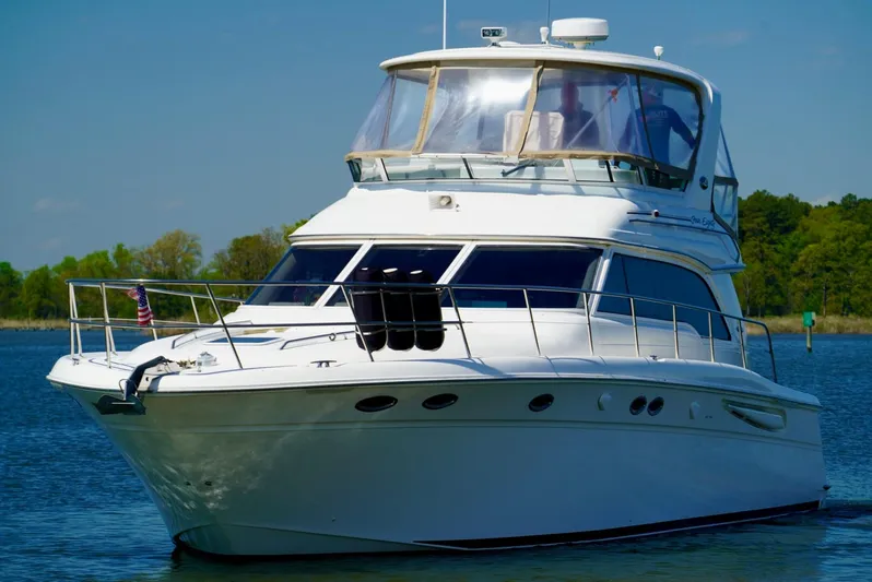 Cheaper II Keep Her Yacht Photos Pics 2002 Sea Ray 480 Sedan Bridge yacht on calm water.