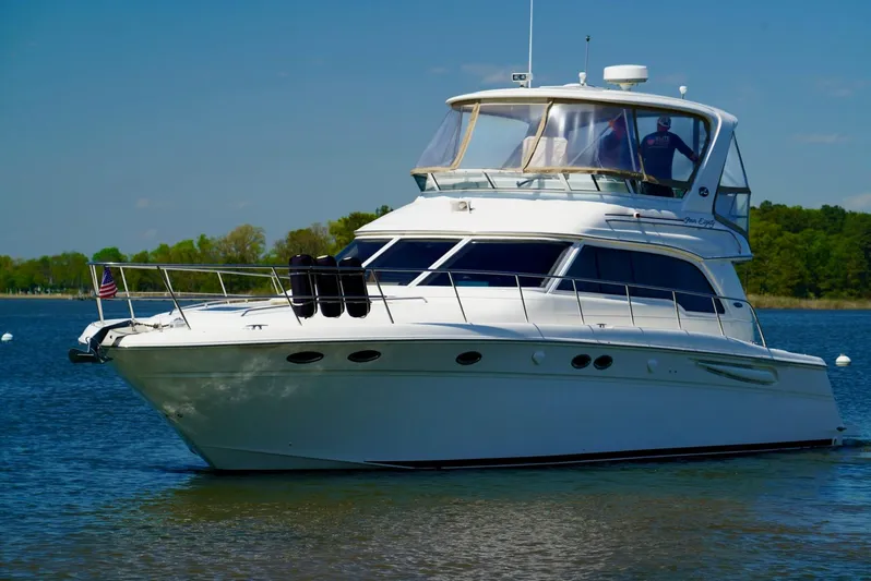 Cheaper II Keep Her Yacht Photos Pics 2002 Sea Ray 480 Sedan Bridge yacht on calm water.