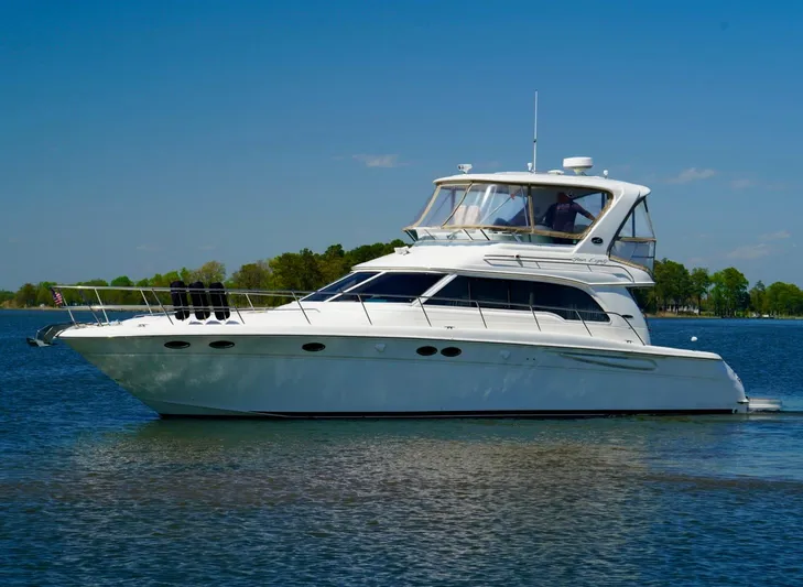 Cheaper II Keep Her Yacht Photos Pics 2002 Sea Ray 480 Sedan Bridge yacht on calm water.