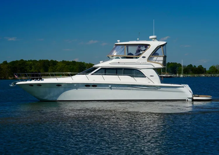 Cheaper II Keep Her Yacht Photos Pics 2002 Sea Ray 480 Sedan Bridge yacht on calm water.