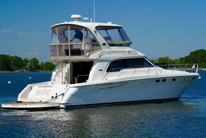 Cheaper II Keep Her Yacht Photos Pics 2002 Sea Ray 480 Sedan Bridge yacht on calm water.