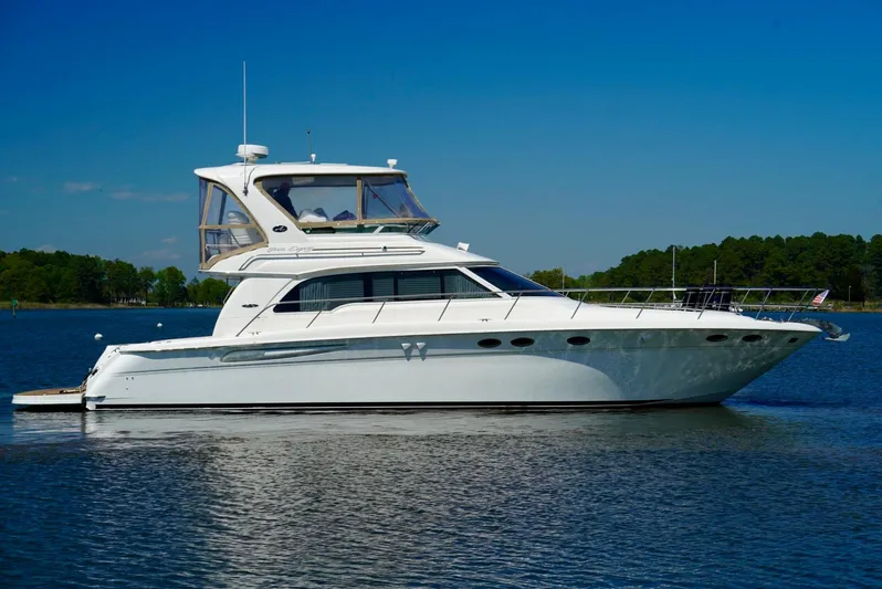 Cheaper II Keep Her Yacht Photos Pics 2002 Sea Ray 480 Sedan Bridge yacht on calm water.