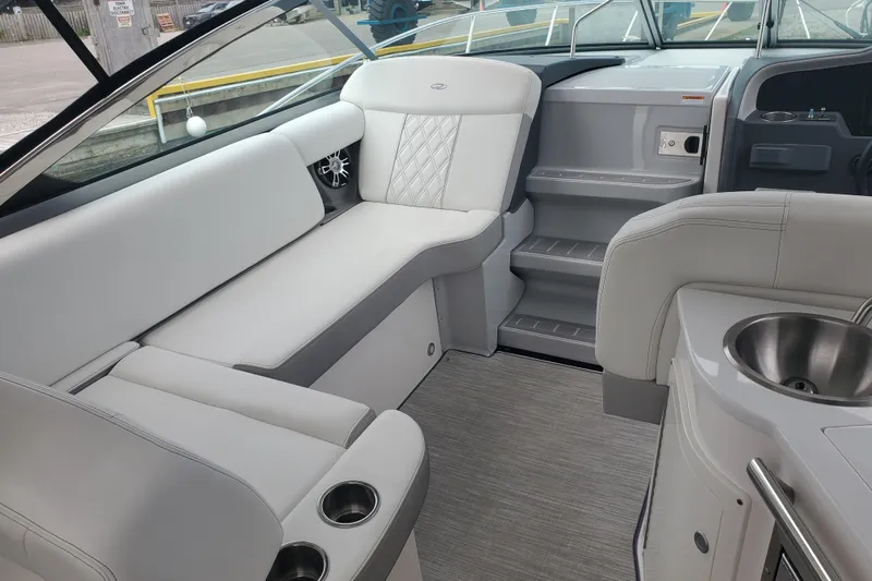 Loml Yacht Photos Pics 2020 Regal 33 Express boat interior with plush seating and modern amenities.